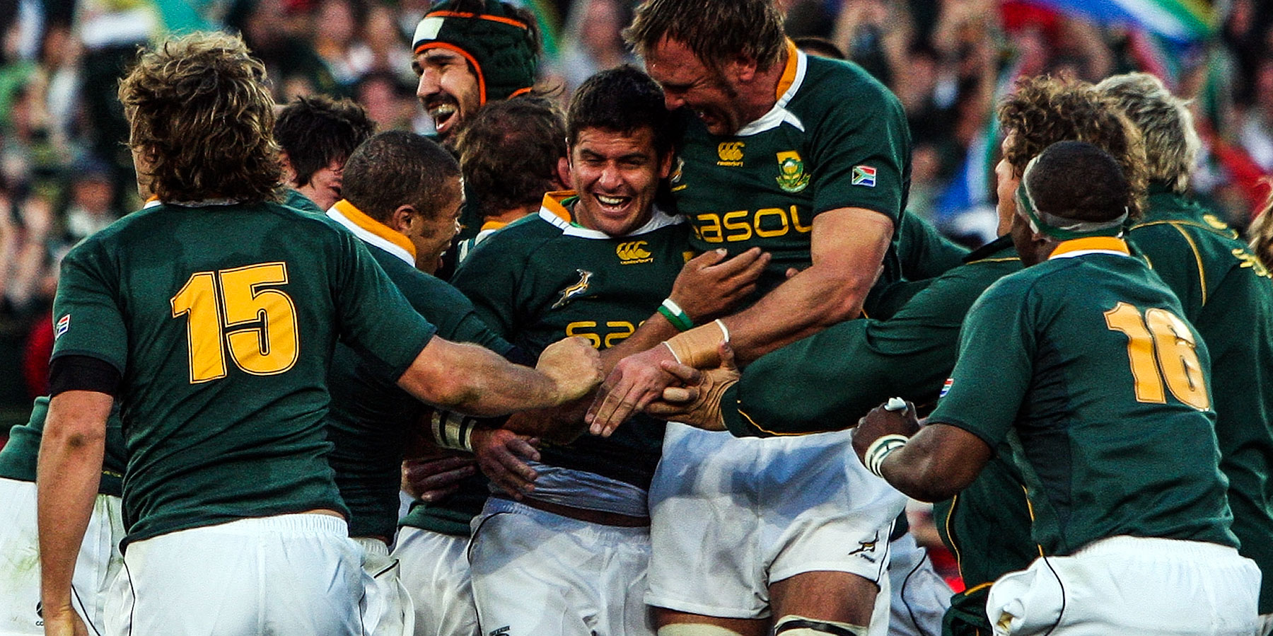 Swamped by ecstatic team-mates after kicking the series-winning penalty goal against the Lions in Pretoria in 2009.