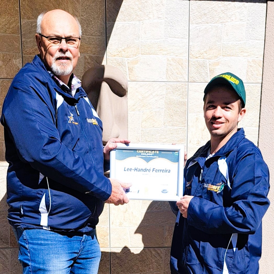 Alfred Ross, BokSmart administrator at the Valke, congratulates Lee-Handre Ferreira on becoming the 200,000th person to complete the BokSmart certification.