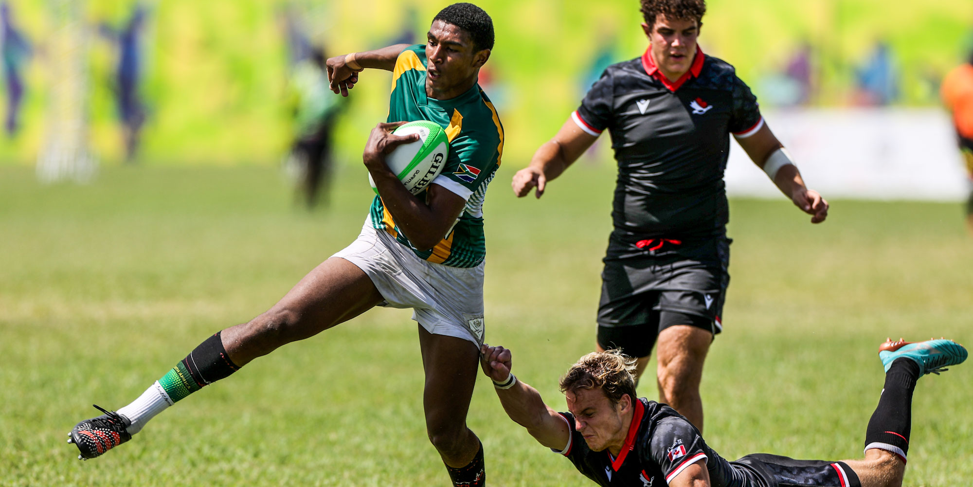 Gino Cupido tries to evade a Canadian defender in the bronze medal match.